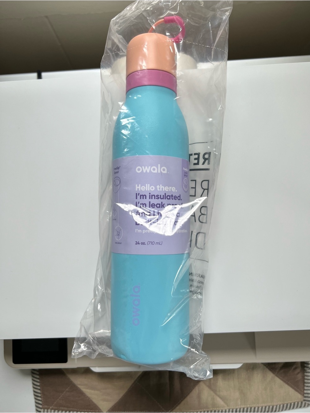 Owala Insulated 24 oz Water Bottle in Light Blue with Pink/Orange Cap